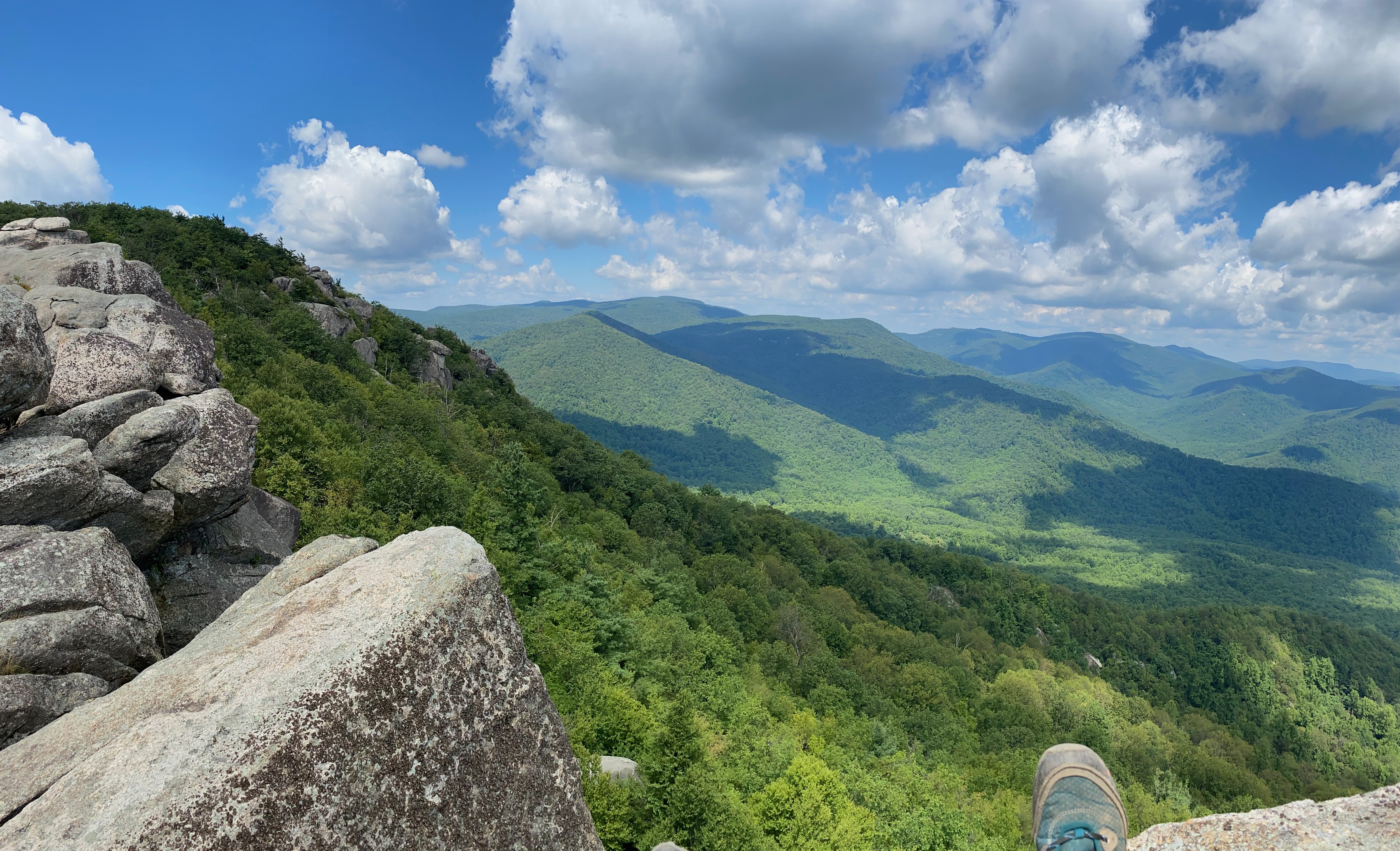 Captivating summer view from the top of Old Rag Mountain, featuring lush greenery, rocky outcrops, and the vibrant beauty of the Shenandoah Valley's scenic landscape