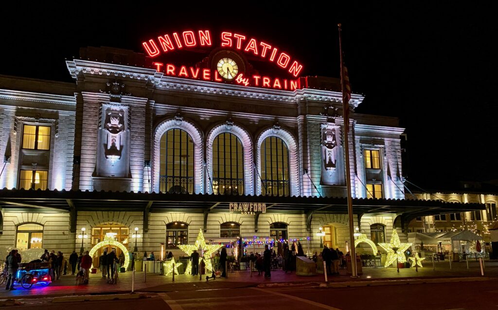 Union Station at night with Christmas lights in front. 