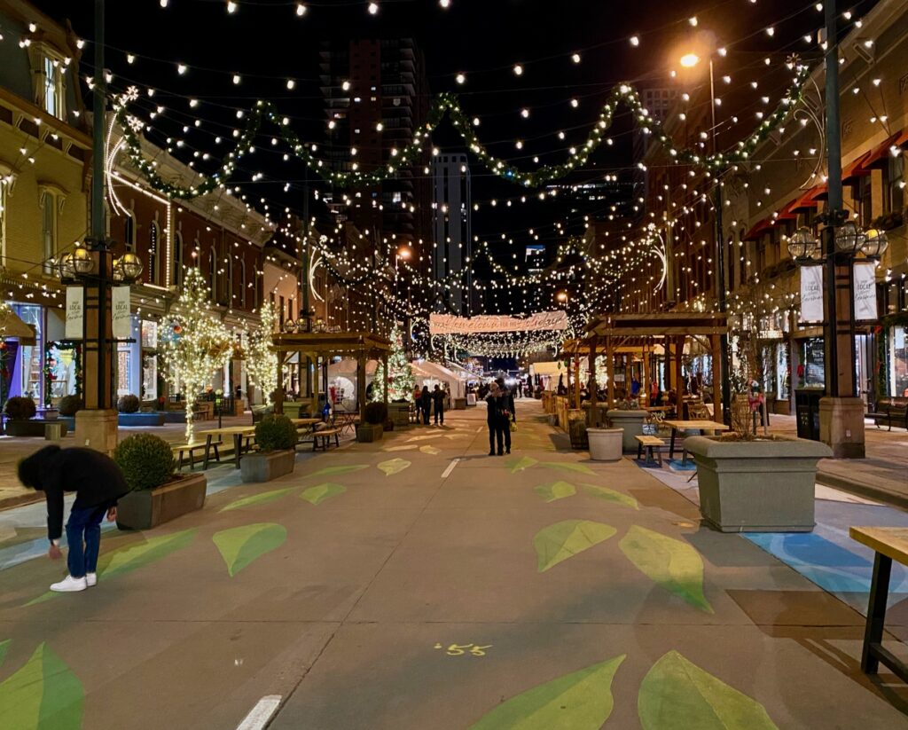 Larimer Square at night with string lights hanging across the road. A must visit place if you're doing Denver in one day. 