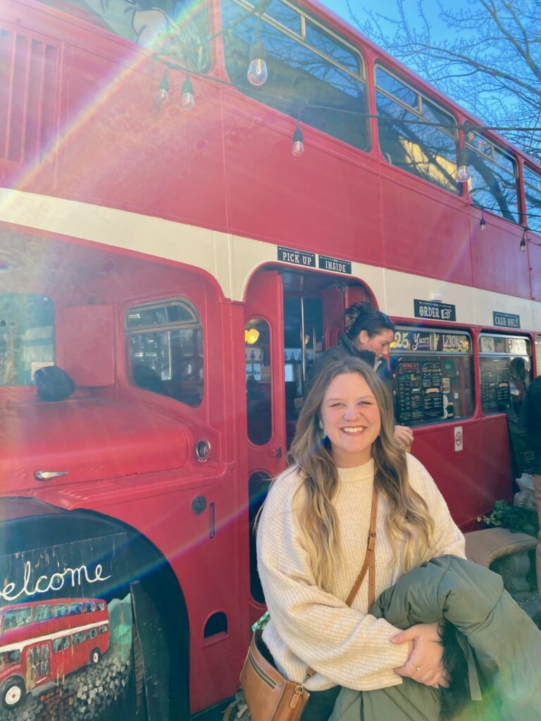 Madi in front of Double D's coffee bus.