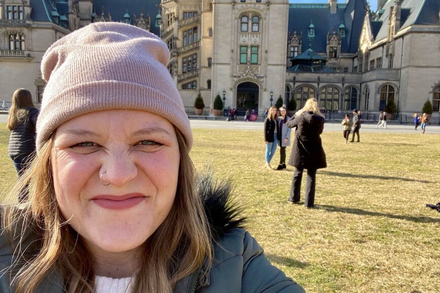 Madi in front of the Biltmore Estate, a must see on your Asheville Bachelorette Party.